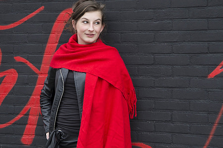 woman wearing red scarf during daytme thumbnail
