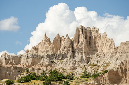 rock formation under cloudy sky thumbnail