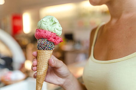 Person Holding Ice Cream With Different Flavors thumbnail
