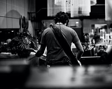 man standing near counter thumbnail