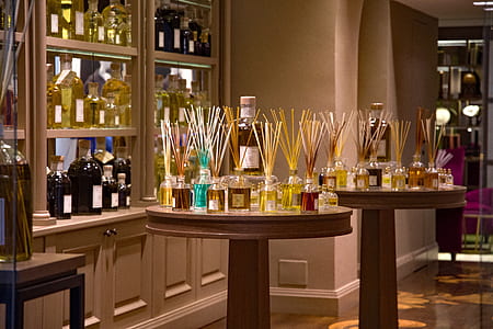 clear glass bottles on round table inside well lit room thumbnail