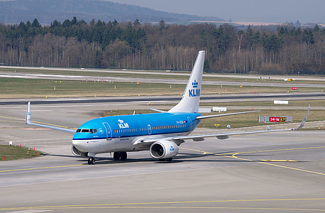 parked blue KLM airliner thumbnail