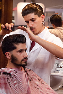 man holding black hair comb on man's hair thumbnail