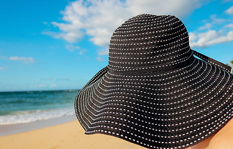 selective focus photography of black and white sunhat thumbnail
