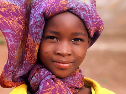 girl wearing yellow shirt and purple headscarf thumbnail