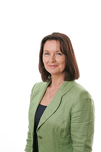 woman wearing green notched lapel suit jacket thumbnail