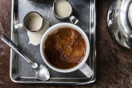 Top View Photo of Coffee Near Spoon thumbnail