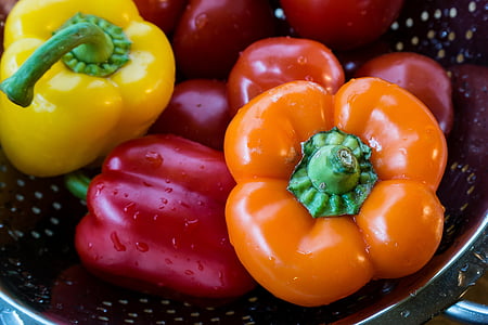 red, yellow, and orange bell peppers on bowl thumbnail