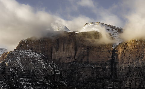 gray stone mountain cliff with fog thumbnail