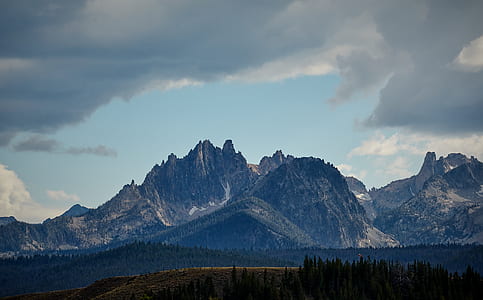 mountain surrounded by green leaf trees thumbnail