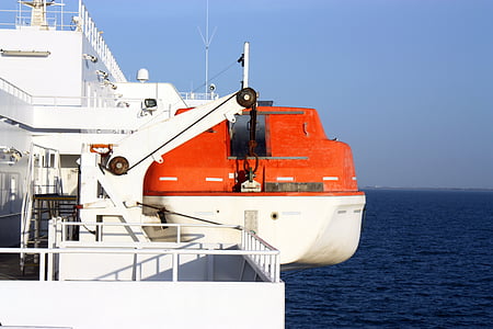 red and white yacht under sunny sky thumbnail