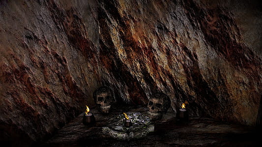 two skull miniatures beside lighted candles thumbnail