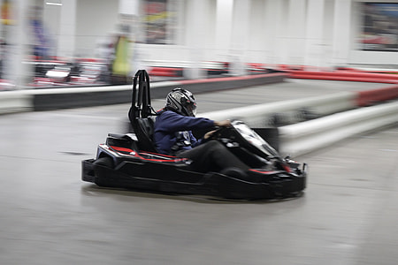person riding on black go kart thumbnail