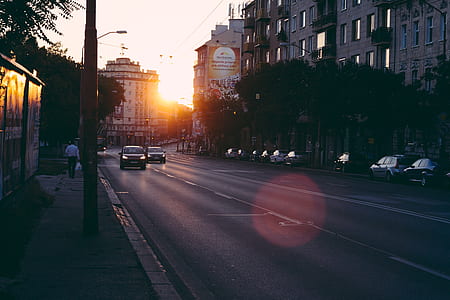 two cars travelling on road during daytime thumbnail