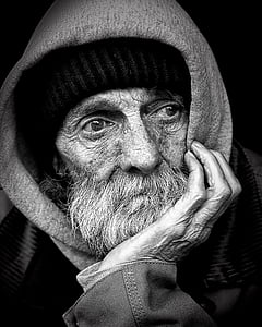 grayscale photo of man wearing hoodie thumbnail