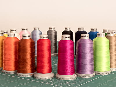 Assorted Sewing Threads on Greensurface thumbnail