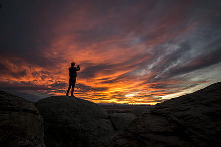 silhouette of man on cliff thumbnail