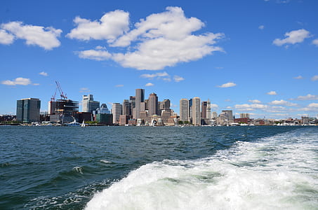 high-rise buildings near body of water during daytime thumbnail