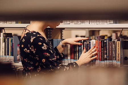 woman in black floral dress on library thumbnail