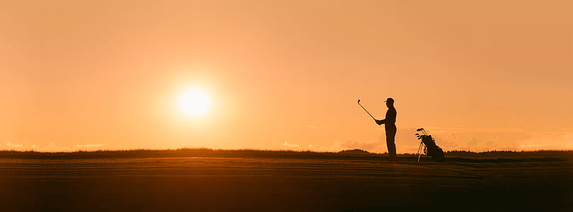 person holding golf club thumbnail