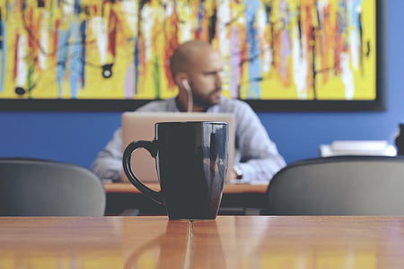 black ceramic mug on table thumbnail