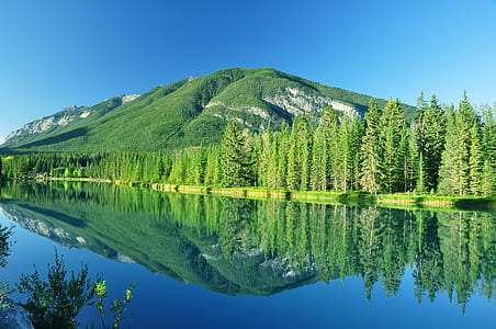 landscape photography of island near bodies of water thumbnail