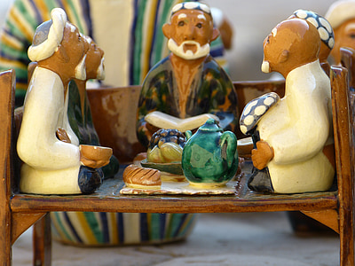 selective focus photograph of group of people dining together figurine thumbnail