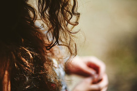 Woman in a dress with a camera thumbnail