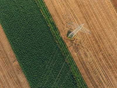aerial photography of green grass field near utility post thumbnail