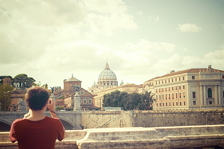 person taking picture of building thumbnail