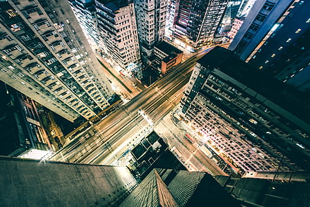 top view of concrete buildings during nighttime thumbnail