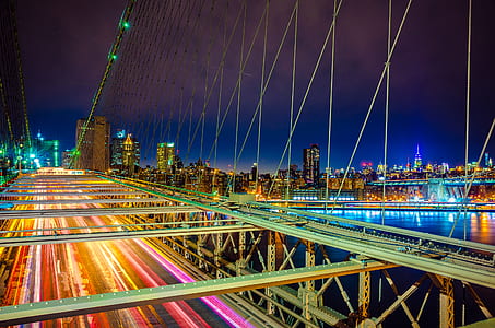 concrete bridge overlooking city view during nighttime thumbnail