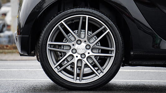 close-up photography of gray multispoke vehicle wheel and tire thumbnail
