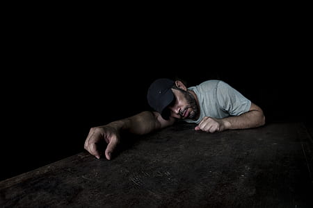 man wearing gray shirt lying on floor thumbnail