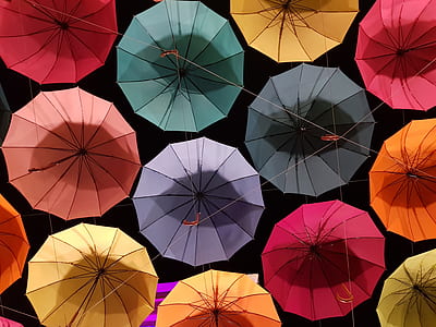 time lapse photography of assorted-color unfold umbrellas thumbnail