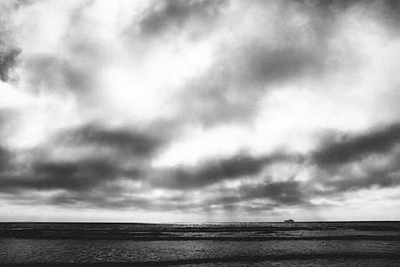 grayscale photography of sea under sky thumbnail