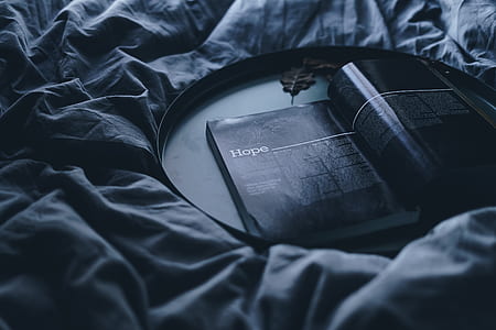 Hope magazine on black wooden tray on black fabric textile thumbnail