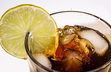 clear drinking glass with beverage and citrus fruit thumbnail