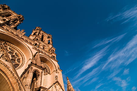 beige church low-angle photography thumbnail