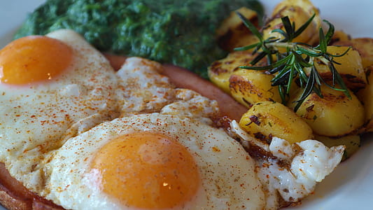 sunny side-up eggs with broccoli and sausage in plate thumbnail