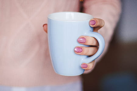Person Holding White Ceramic Mug thumbnail