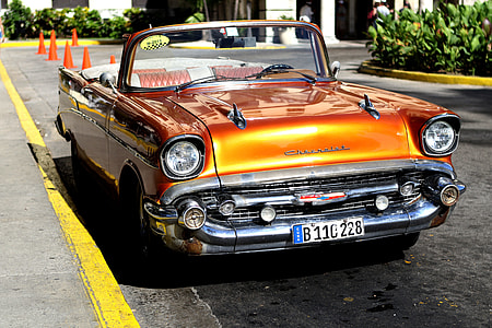 orange convertible coupe on road thumbnail