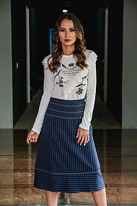 Photo of Woman Wearing Long sleeved Top and Long Skirt thumbnail