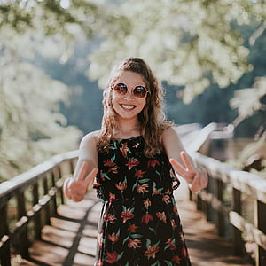 woman stands in bridge selective focus photography thumbnail