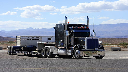blue semi truck on road thumbnail