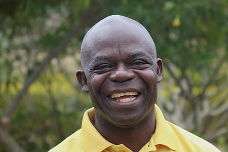 selective focus photography of man smiling thumbnail