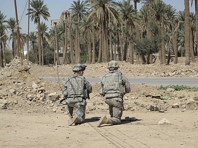 two soldier kneeling on field near palm trees thumbnail