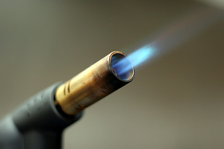 selective focus photography of torch lighter with flame thumbnail