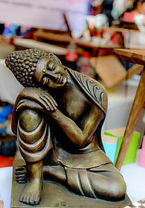 brown ceramic guatama buddha figurine thumbnail