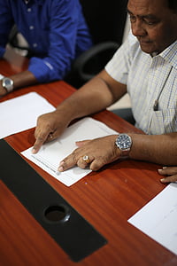 man holding white printer paper thumbnail